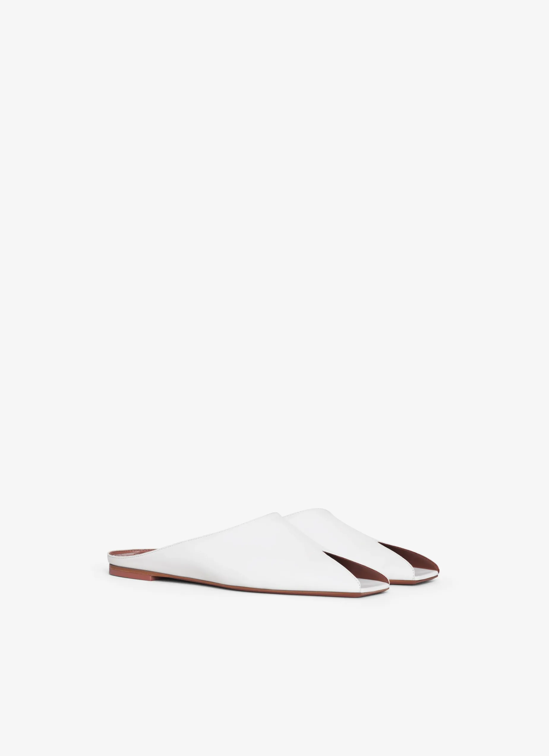 SPIKE FLAT MULES IN CALFSKIN