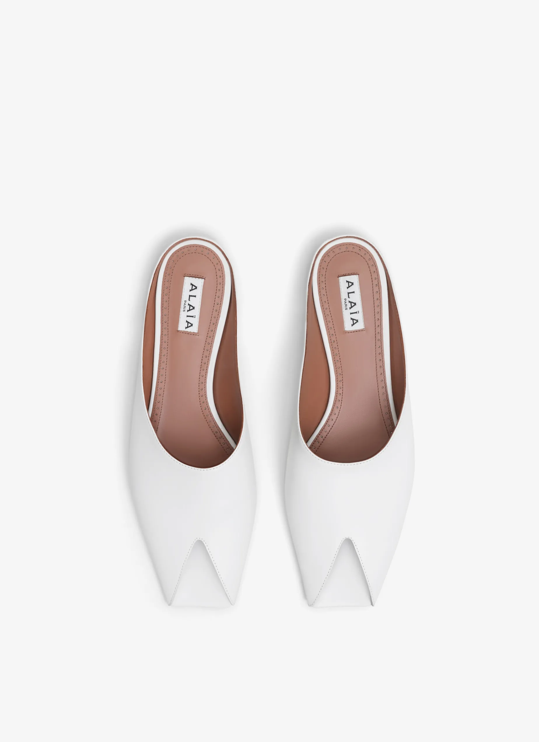 SPIKE FLAT MULES IN CALFSKIN