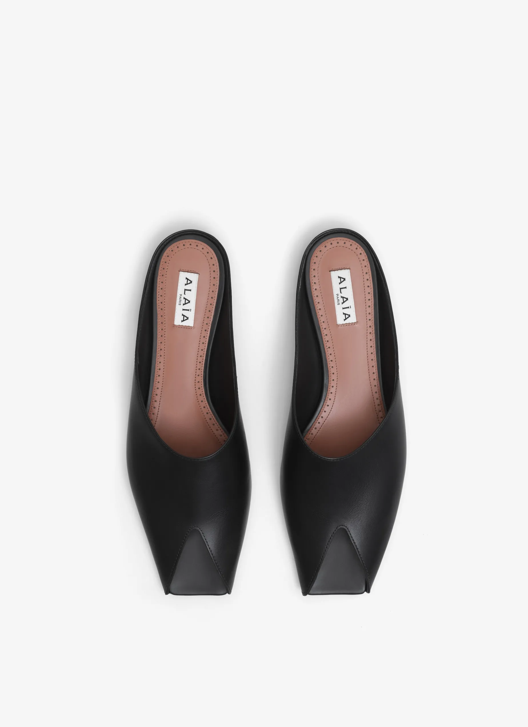 SPIKE FLAT MULES IN CALFSKIN